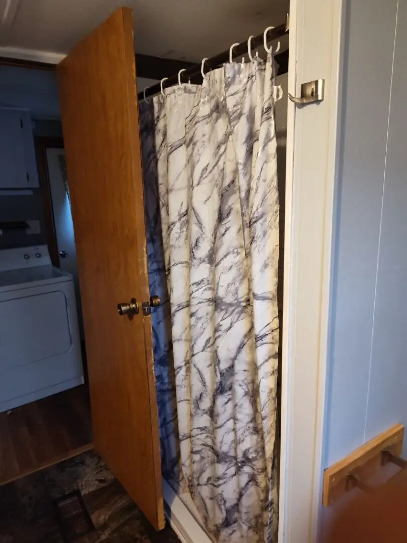 Marble shower curtain in a bathroom.