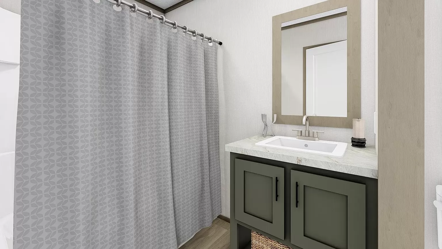 A modern bathroom with a shower curtain and vanity.
